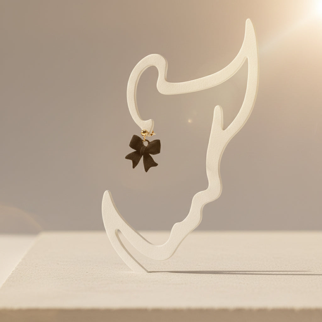 Boucles d'oreilles "Mademoiselle nœud" noir/doré imprimées en 3D | Bijoux 3D - POMM Créations