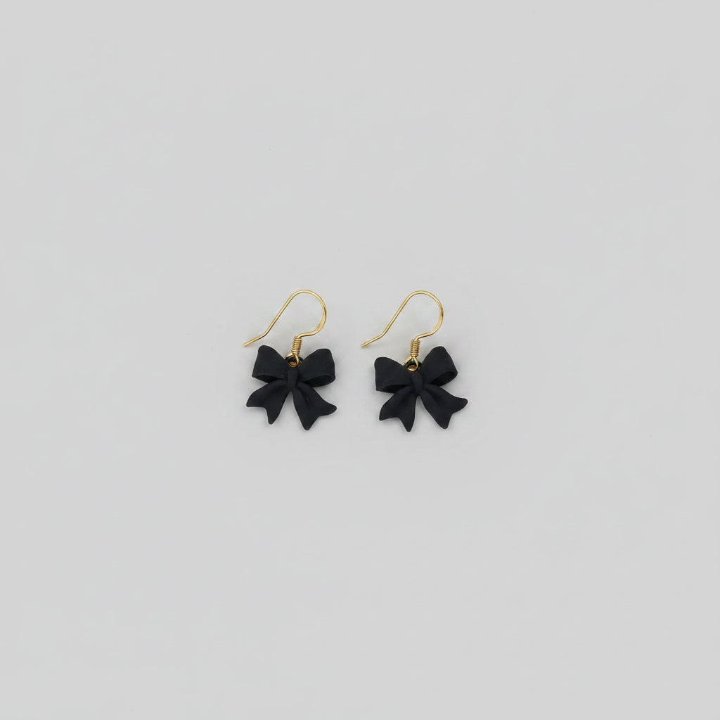Boucles d'oreilles "Mademoiselle nœud" noir/doré imprimées en 3D | Bijoux 3D - POMM Créations
