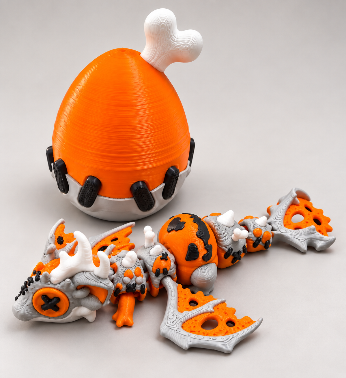 Dragon articulé et œuf citrouille en 3D